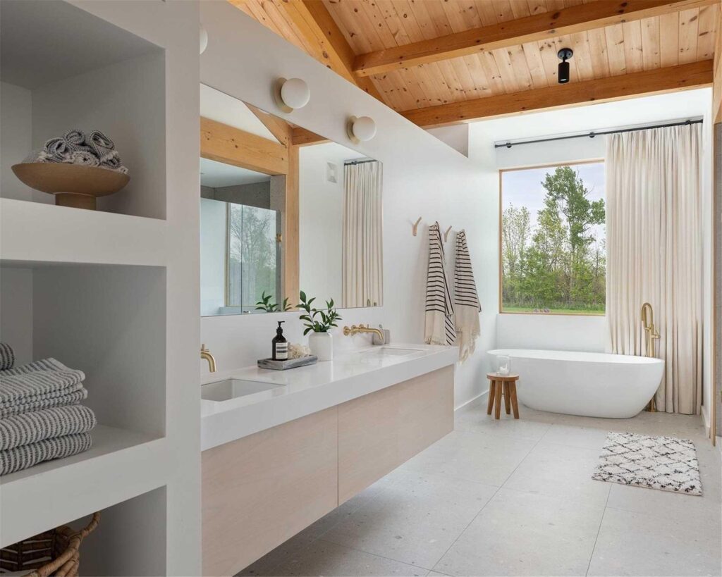 Beautiful modern double sink custom vanity with thick quartz countertops and wall mounted faucets.