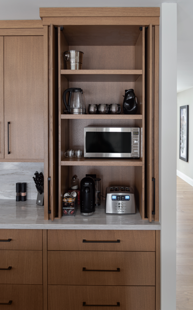 Warm Rift-Cut White Oak Appliance Garage with pocket doors to hide the mess! - Burlington Ontario Designed by EKR Designs