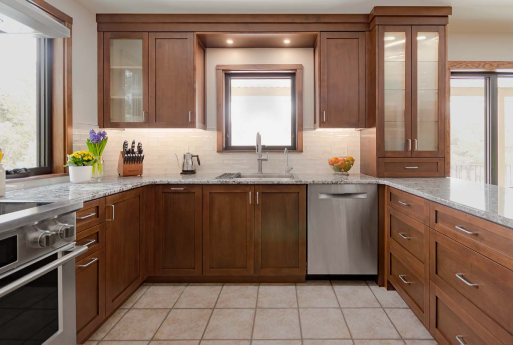 Beautiful maple kitchen with reeded glass display cabinets, undercounter lighting and lots of personality. - Georgetown, Ontario