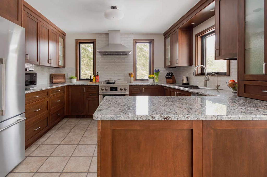 Beautiful maple kitchen with reeded glass display cabinets, undercounter lighting and lots of personality. - Georgetown, Ontario