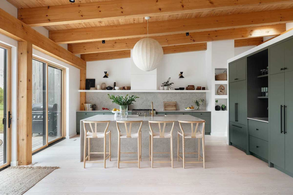 Beautiful custom dark green white oak kitchen with black hardware, and white range hood and shelf. - Aberfoyle Ontario